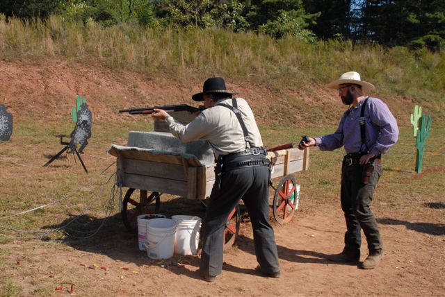 One Eyed Black Jack shooting shotgun.